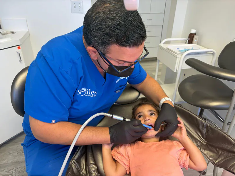 Dr. Sepehr Nassiripour performing pediatric dental fillings